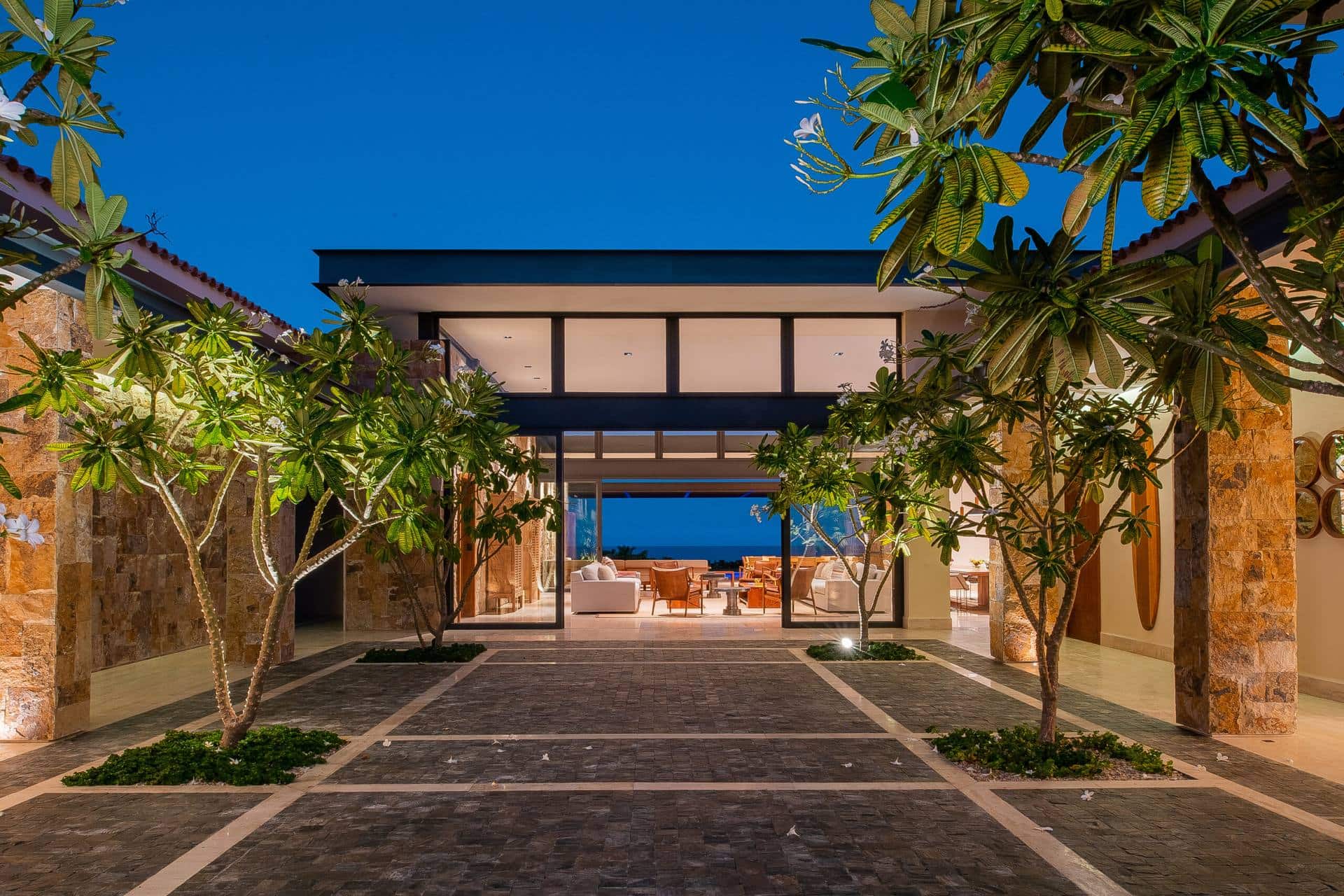 A Luxmex luxury villa courtyard at dusk in Los Cabos